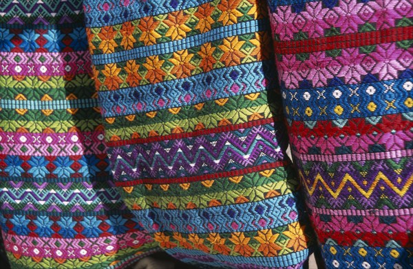 MEXICO, Chiapas, San Cristobal de Las Caras, "Close view of contrasting, multi coloured pattern textiles."