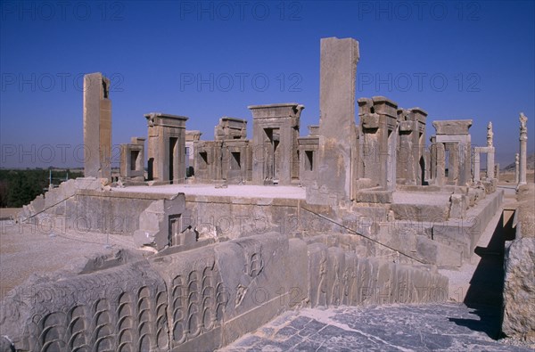 IRAN, South, Persepolis, "Fifth century BC Archaemenid palace complex.  Xerxes Palace, raised, rectangular archways and column ruins.  "