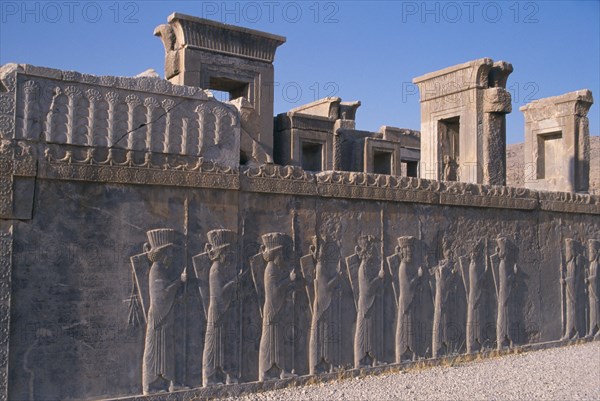 IRAN, South, Persepolis, Fifth century BC Archaemenid palace complex. Xerxes Palace wall with stone relief -carved frieze of a procession of delagates.