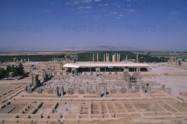 IRAN, South, Persepolis, Fifth century BC Archaemenid palace complex.  View over ruins from the tomb of Axerxes II.  The name Persepolis is Greek meaning City of the Persians.