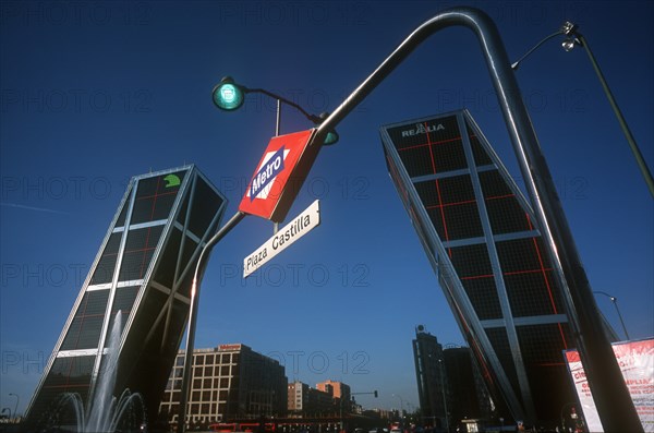 SPAIN, Madrid, Paseo de La Castellana. Puerta de Europa office complex at entrance to business district.  Two modern towers partly framed by entrance to Plaza Castilla metro station.