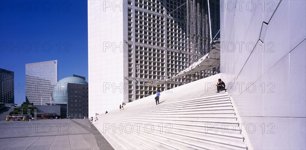 FRANCE, Ile de France, Paris, "La Defense. The Grande Arche de La Defense, people on flight of steps."