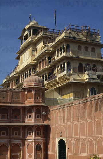 INDIA, Rajasthan, Jaipur, City Palace / Royal Palace looming over pink and white building
