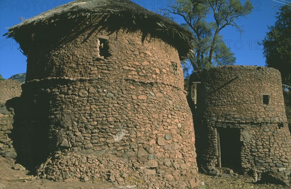 ETHIOPIA, Lalibela, "Original thatched mud brick round houses, now part of Unesco World Heritage Site."
