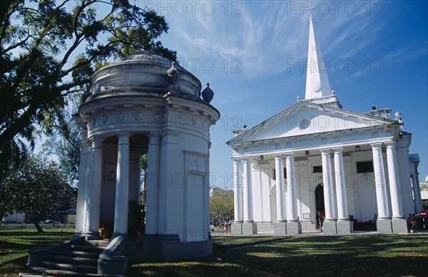 MALAYSIA, Penang, Georgetown, St. Georges Church.  Anglican church built in 1817 using convict labour.  Classical style exterior with free standing open sided turret in foreground.