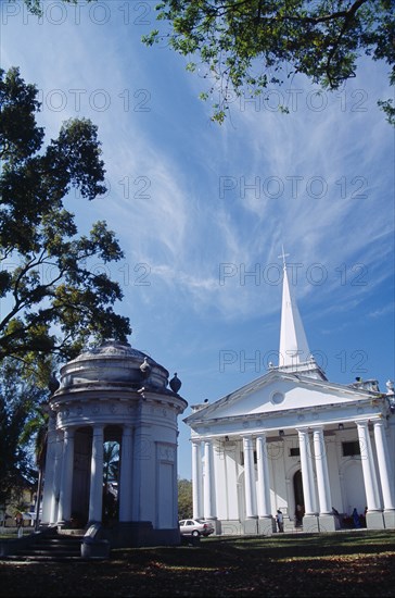 MALAYSIA, Penang, Georgetown, St. Georges Church.  Anglican church built in 1817 using convict labour.  Classical style exterior with free standing open sided turret in foreground.