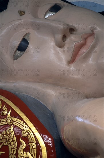 MALAYSIA, Penang, Georgetown, Wat Chayamangkalaram.  Interior.  Detail of face of  thirty-two metre long reclining Buddha.