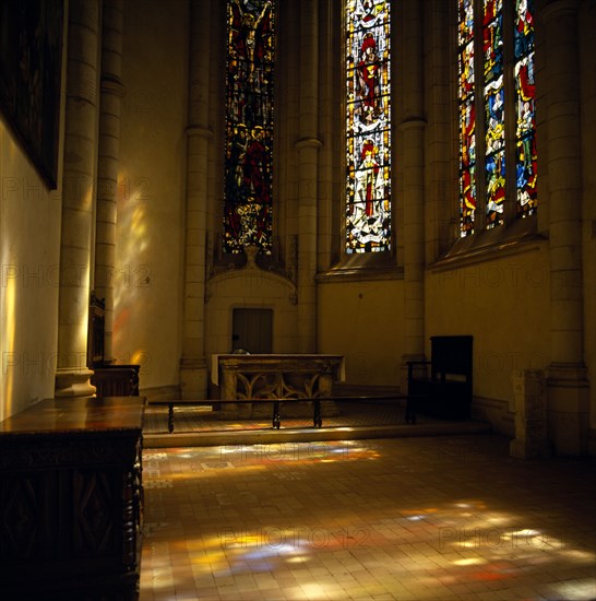 FRANCE, Loire Valley, Loir et Cher, Blois Chateau. The Chapel with reflections through stained glass windows