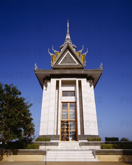 CAMBODIA, Choeung Ek, Choeung Ek Killing Fields.  Memorial Stupa erected in  1988 and containing over eight thousand skulls of victims of the Khmer Rouge.