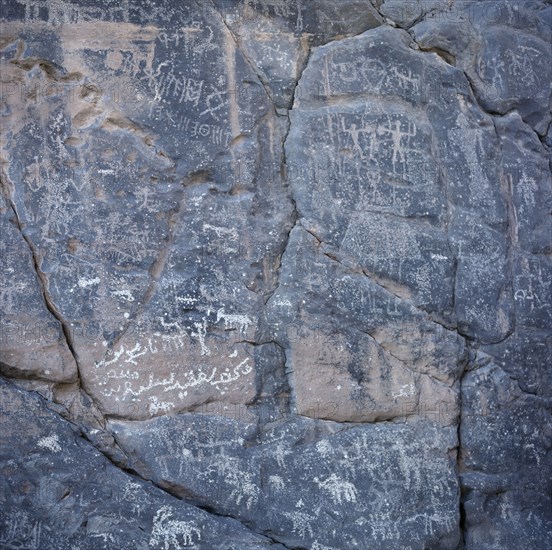 OMAN, Jebel Akhdar, Wadi Sahtan, Rock drawings depicting hunting or battle scene.