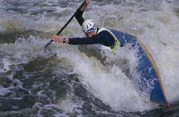 10001994 SPORT Watersport Canoe  Canoeist in Slalom rapids in Holm Pierre Point in Nottingham  England