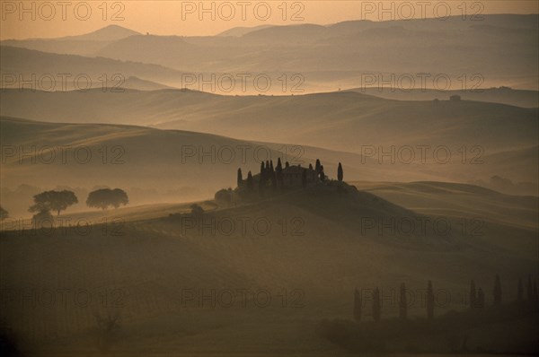 ITALY, Tuscany, San Quirico area, Early misty morning view over the Belvedere