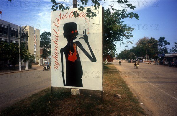 VIETNAM, Tien Giang Province, My Tho, Anti smoking poster at roadside.