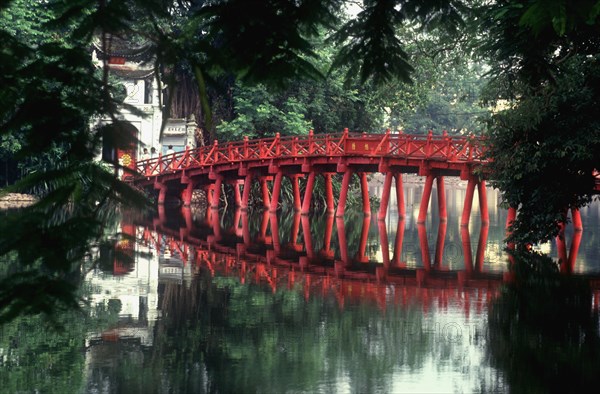 VIETNAM, Hanoi, "Le Petit Lac at Hoan Kiem Lake.  The red painted Huc bridge, reflected in the lake, leading to Ngoc Son Temple "