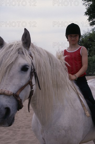 20002708 SPORT Equestrian Horse Riding Young girl on pony
