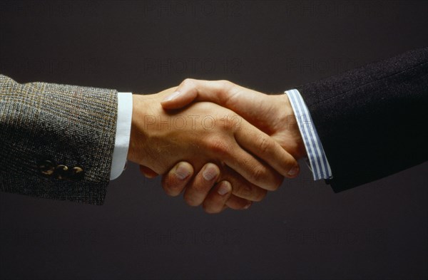 BUSINESS, Handshake, Close up of two men shaking hands as a greeting