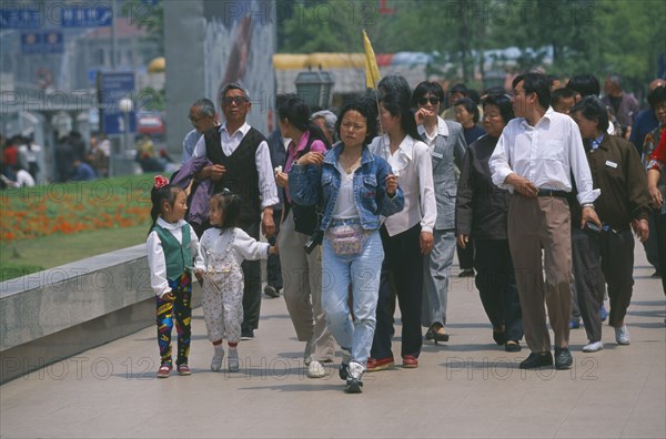 CHINA, Shaanxi, Shanghai, Chinese tourists walking along the Bund