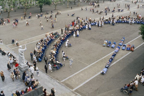 FRANCE, Lourdes, Pilgrimage at the holy shrine with invailds in shape of cross