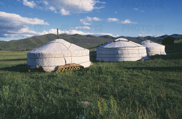 MONGOLIA, Khentii Province, General, Gers in mountain landscape.