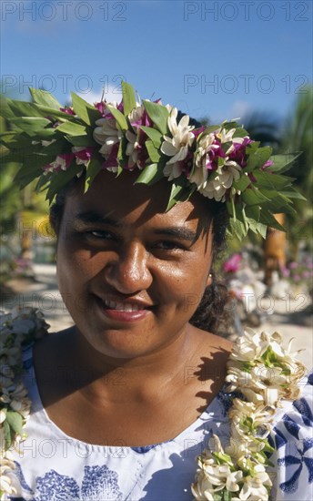 PACIFIC ISLANDS, Cook Islands, Aitutaki, Portrait of a woman wearing a garland