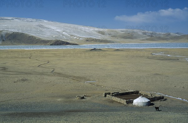 MONGOLIA, Bayan Olgii Province, View over Kazakh nomad camp with single yurt and surrounding landscape