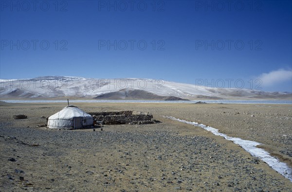 MONGOLIA, Bayan Olgii Province, View over Kazakh nomad camp with single yurt and livestock coral Rtnd 2 VKB 15/5/2009