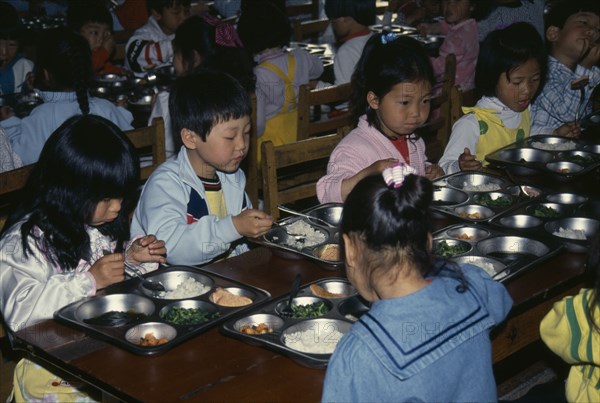 SOUTH KOREA, Mokpo, Nursery school pupils eating lunch.