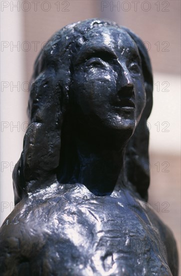 HOLLAND, Noord, Amsterdam, Westermarkt. Statue of Anne Frank the young diary writer during the Nazi occupation of World War II