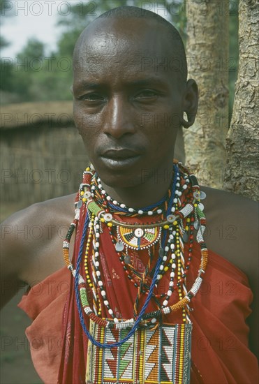 KENYA, Masai Mara, Tribal People, Masai guide wearing traditional jewellery