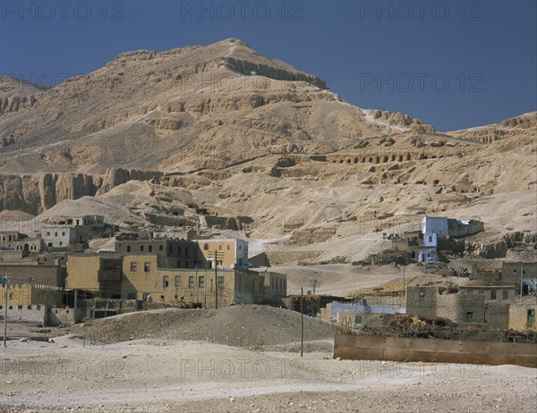 EGYPT, Nile Valley, Thebes, The Ramesseum. View of  Tombs of the nobles in hillside opposite the Ramesseum.