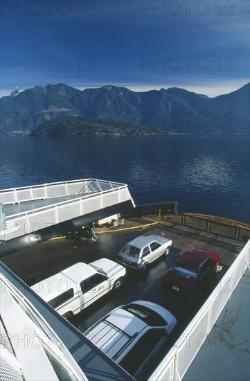CANADA, British Columbia, Howe Sound, Ferry heading for Horseshoe Bay north of Vancouver.  View over deck and parked cars.
