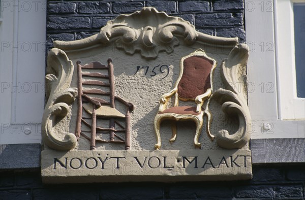 HOLLAND, Noord, Amsterdam, Close up detail of a wall tablet used before house numbers were added