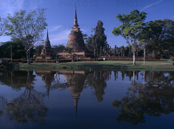 THAILAND, North, Sukhothai Province, Sukhothai Historical Park. Wat Sra Sri on island with reflections on water