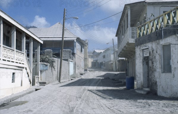 MONSERRAT, Plymouth, Housing covered in layer of volcanic ash after 1997 eruption.