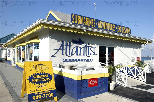 WEST INDIES, Cayman Islands, Submarine Excursion shop with sandwich board outside