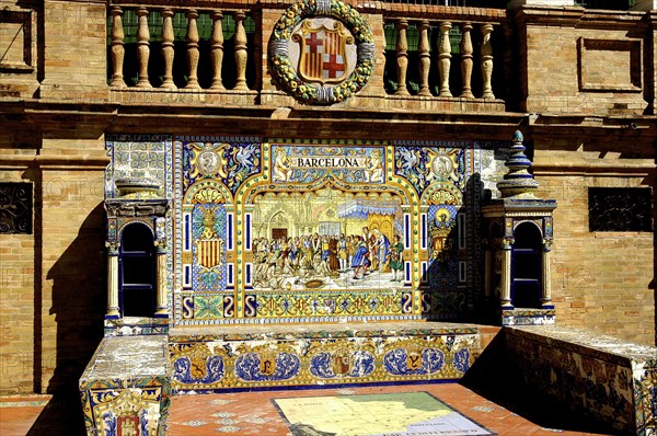 SPAIN, Andalucia, Seville, Plaza de Espana. One of the tiled seats that line the semicircular plaza with the word Barcelona on