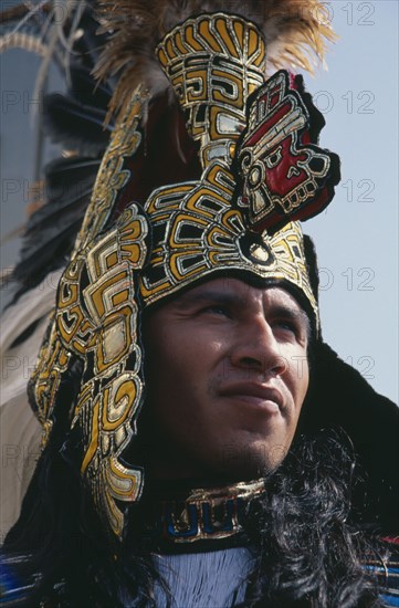 MEXICO, Mexico City, Our Lady of Guadaloupe Festival male Indian dancer outside the Basilica