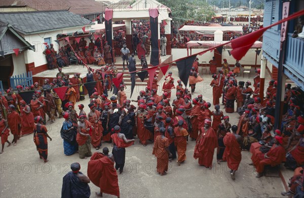 GHANA, People, Ashanti, View looking down on group of Ashanti people gathered at a funeral dressed in red the colour of mourning