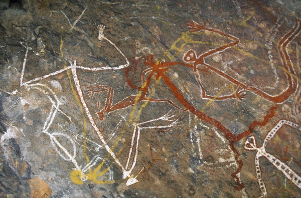AUSTRALIA, Northern Territory, Kakadu National Park, Aboriginal rock painting depicting dancing figures at Nourlangie Rock