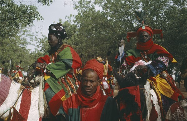NIGERIA, North, Katsina, "Salah Day.  The Emirs entourage, mounted men in brightly coloured costume."