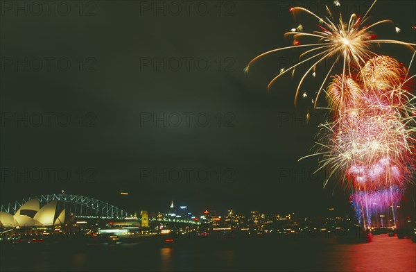 AUSTRALIA, New South Wales, Sydney, New Years fireworks display over Sydney Harbour with the Opera House and Harbour Bridge illuminated