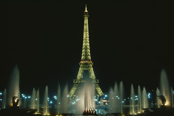 FRANCE, Ille de France, Paris, The Eiffel Tower and the Trocadero Gardens illuminated at night seen from Palais de Chaillot