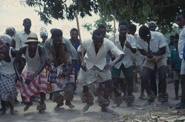 TANZANIA, Dodoma, Ngomas dancers using clusters of nuts tied around their ankles as instruments