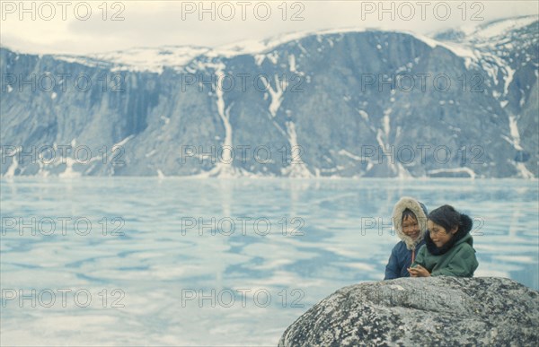 CANADA, Nunavut, Baffin Island, Inuit children in glacial landscape.