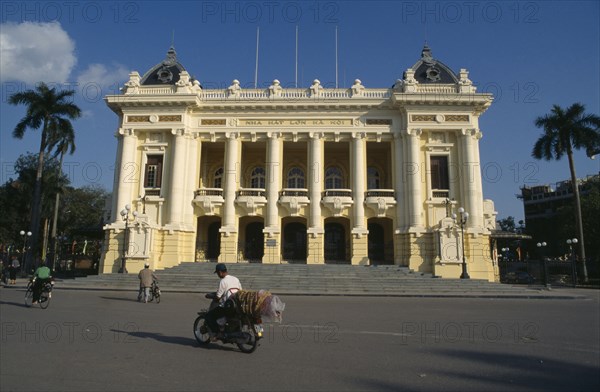 VIETNAM, North, Hanoi, The Opera House.  Exterior facade with passing cyclist and moped.