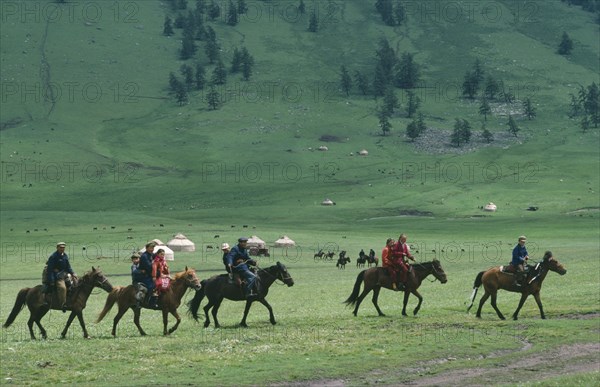 CHINA, Xinjiang Province, Kazakhs, Kazakh people on horseback on their way to the horse races