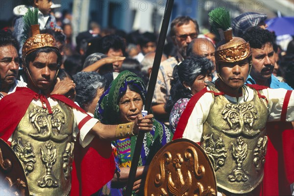 GUATEMALA, Antigua, Mayan Indian women and men dressed as roman soldiers at the famous Easter procession