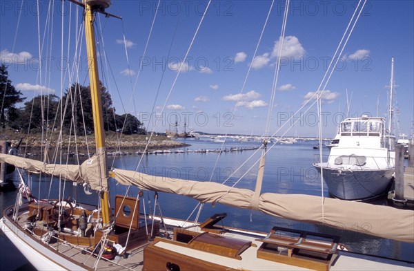 USA, Massachusetts, Plymouth, View over moored boats in the harbour with the Mayflower 2 in the distance