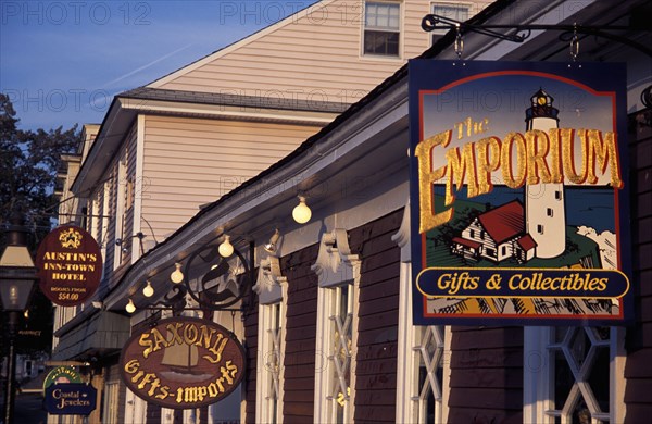 USA, Rhode Island, Newport, View along row of gift shop facades with hanging signs