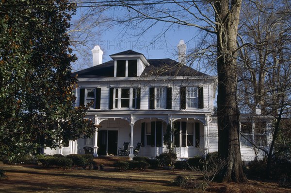 USA, Georgia, Madison County, Antebellum Home with rocking chairs on the porch